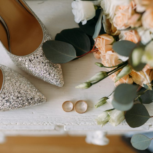 Wedding shoes, rings and flowers