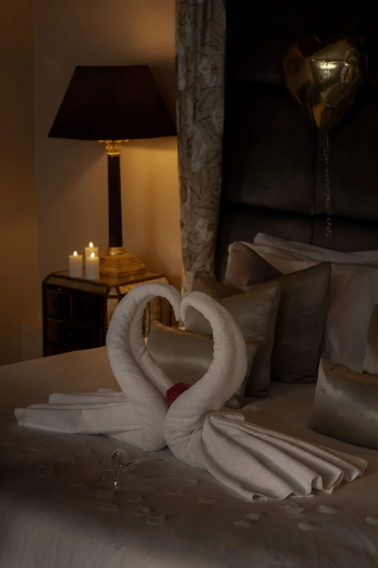 Candlelight beside the bed in the wedding suite